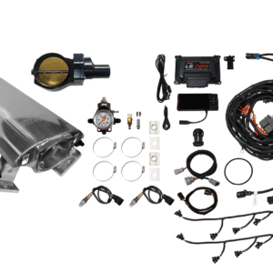 Car engine intake manifold with fuel injection components laid out.