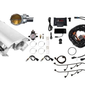 Car turbocharger and related installation components laid out on white.