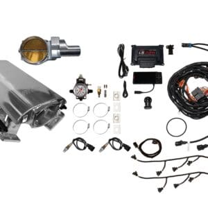 Car engine parts and ignition components laid out for assembly.