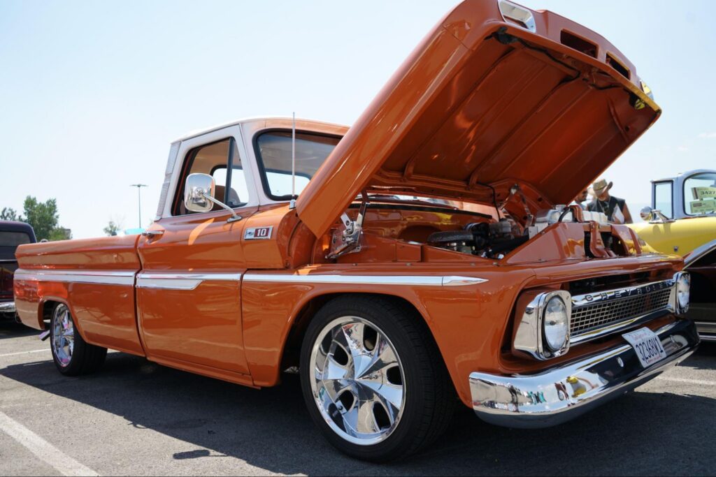 photo of orange classic truck with the hood open